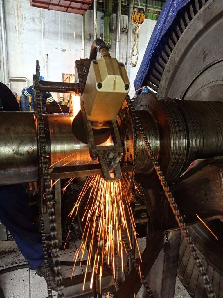 Goltens technicians machining damaged turbine rotor shaft journal