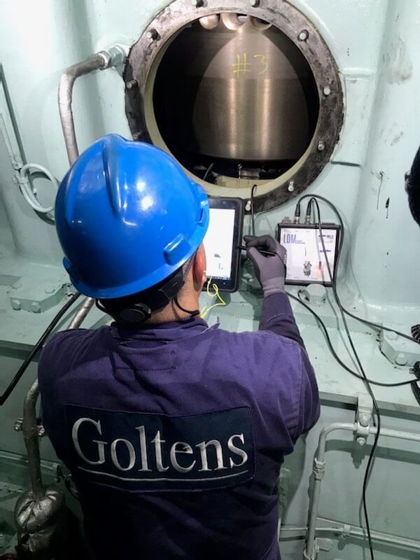 Goltens Technician conducting measurements with Chris Marine LDM on MAN 60MC-C