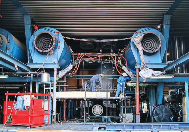 Preparing to move the engine block to the barge