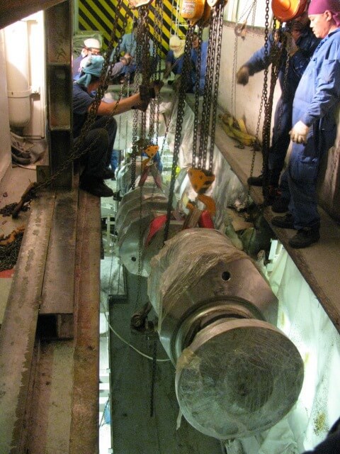 Lowering of the new crankshaft from the alley way to engine room