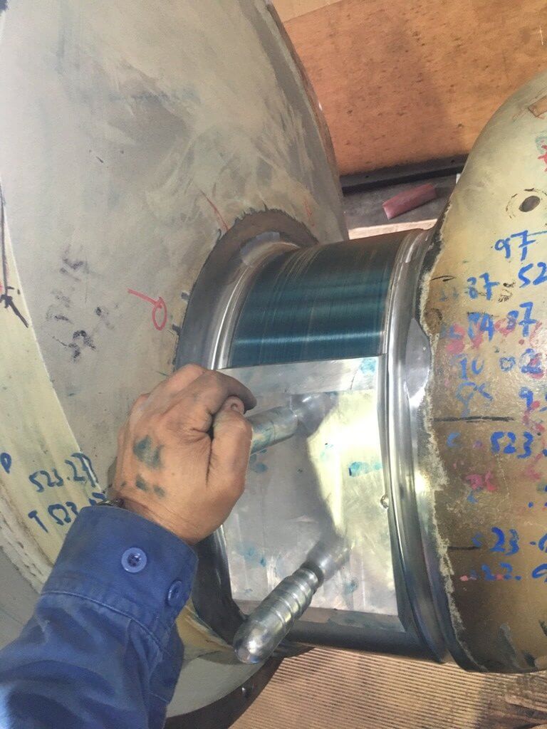 Goltens using a blueing dummy to check the journal surface after machining