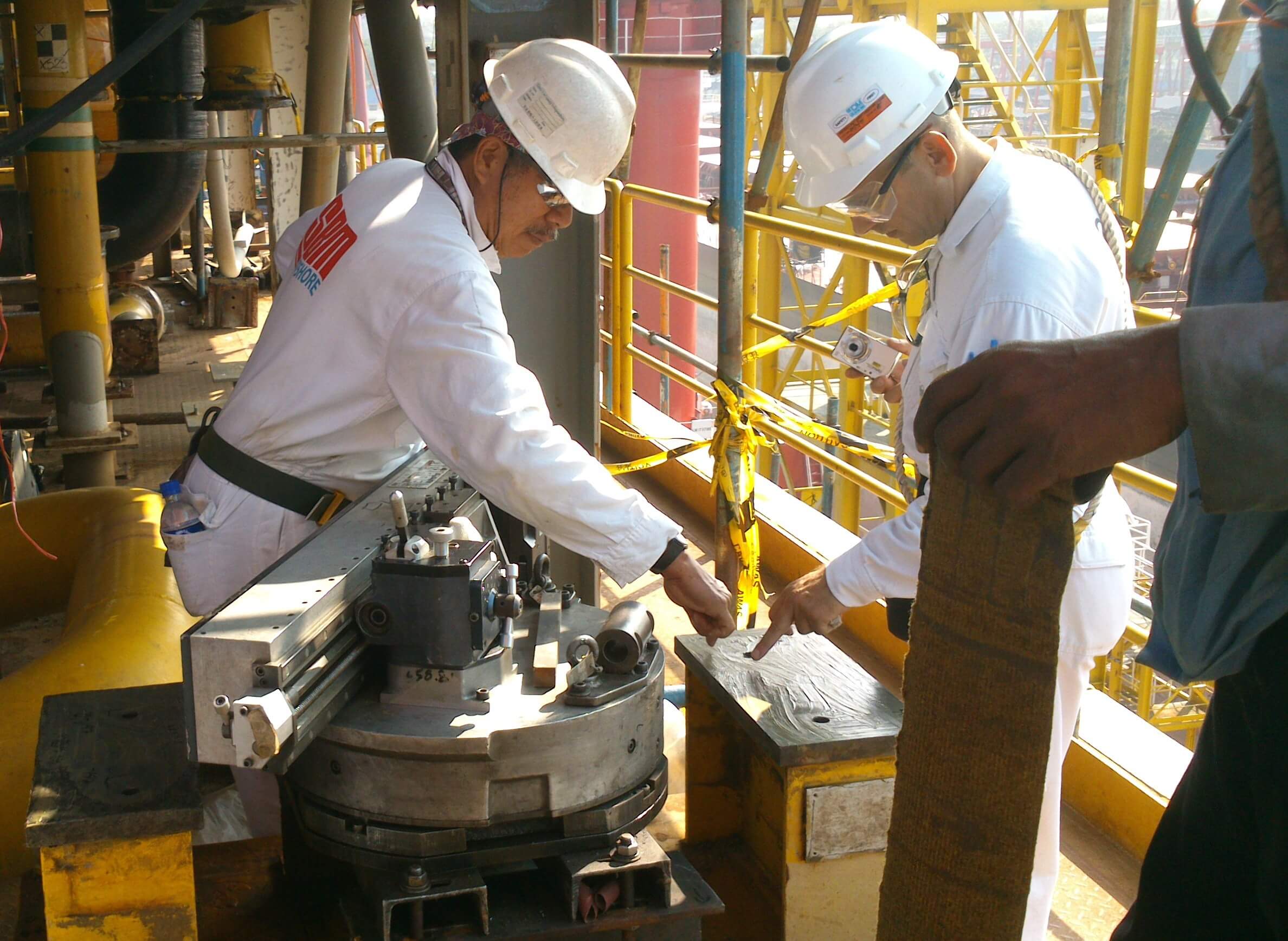 Goltens machinists setting up flange facer on foundation skids