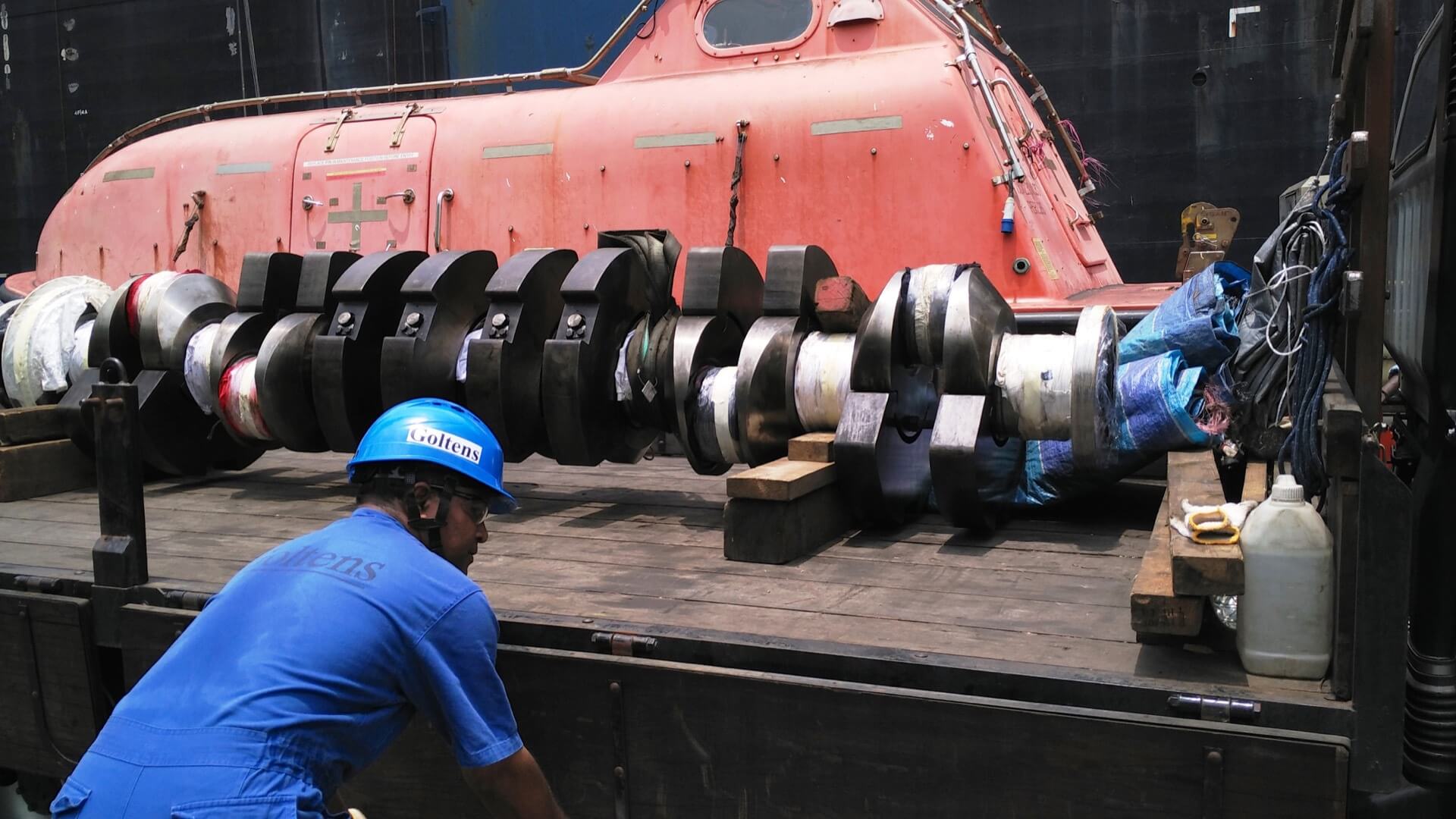 Damaged MAN B&W 6L28/32H crankshaft rigged for transport to shop