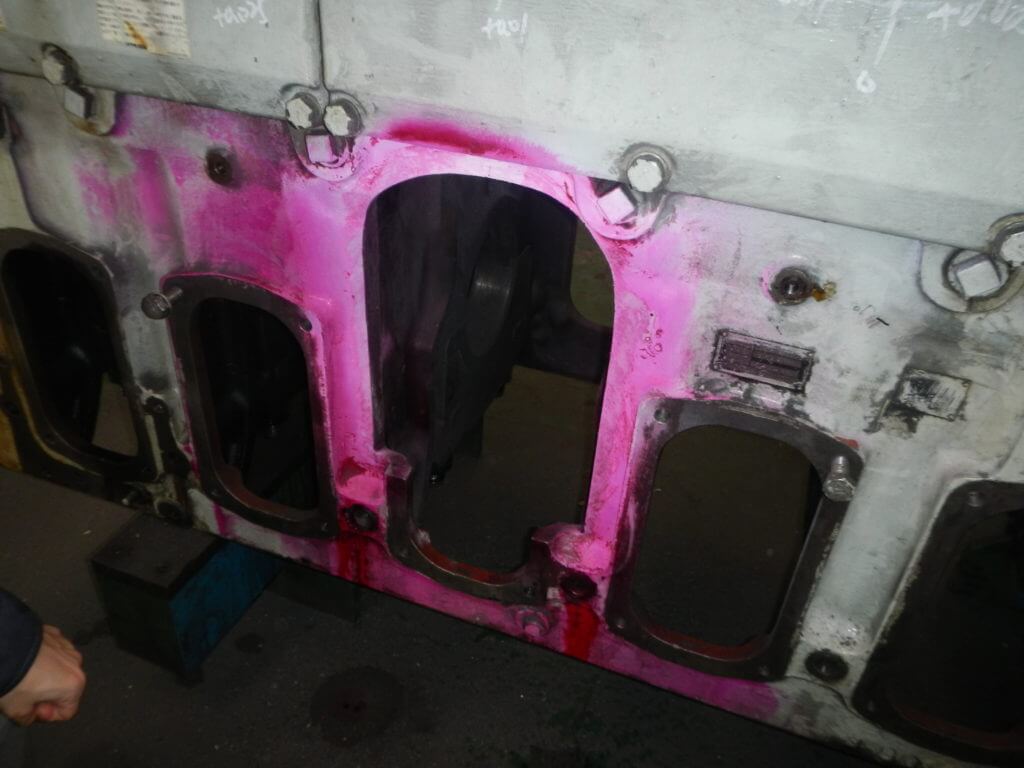 Damaged edges of crankcase door removed prior to metal stitching by Goltens