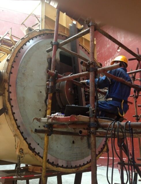 Goltens technicians completing flange facing on crane pedestal at Guangzhou COSCO shipyard