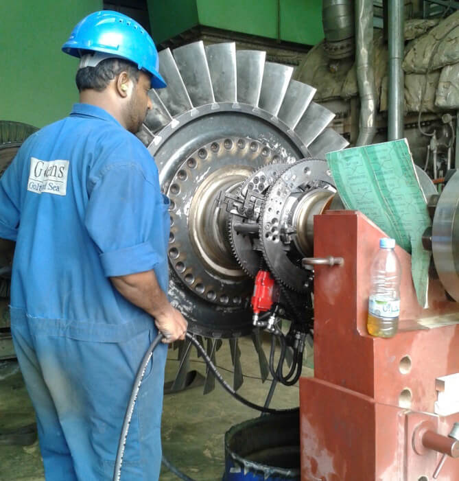 Goltens In-place machinists polishing the Exhaust side journal on gas turbine
