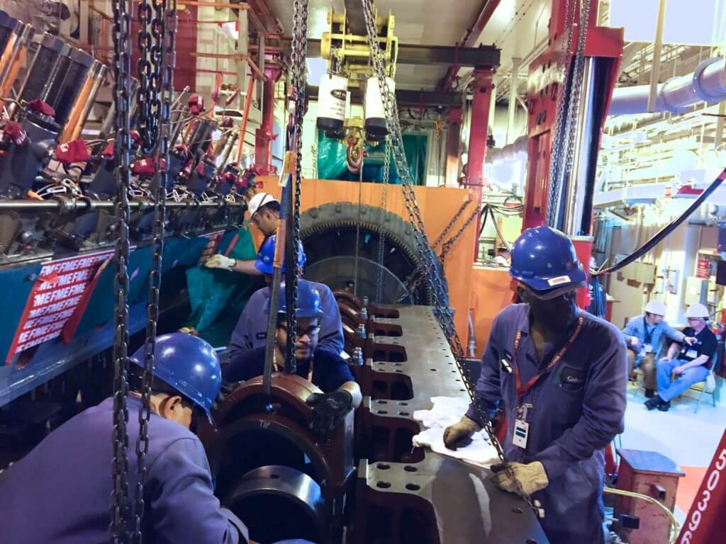 Goltens techs replacing bearing caps to check line bore on nuclear plant backup generator