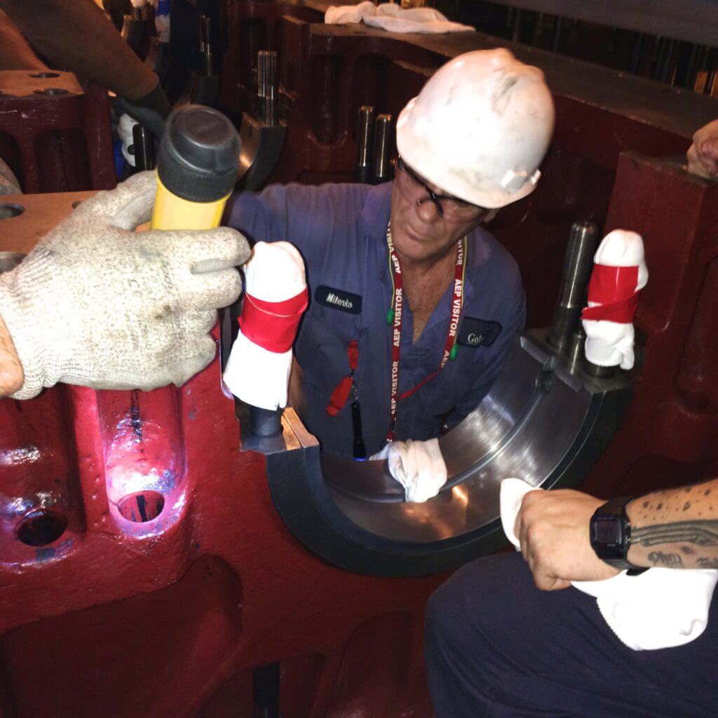 Goltens checking lower main bearing surface prior to Worthington crankshaft installation at nuclear power plant