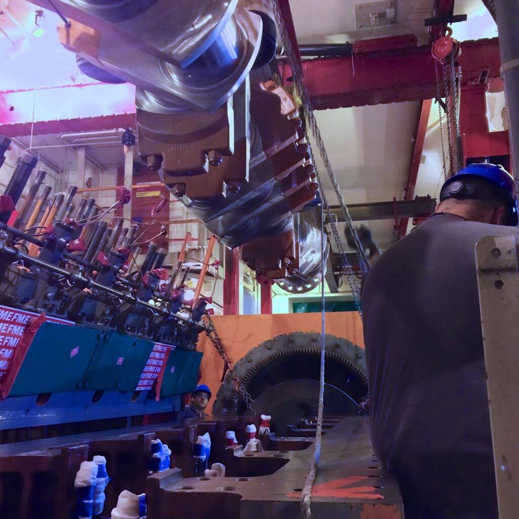 Goltens technicians rigging replacement crankshaft onto bedplate at nuclear power plant